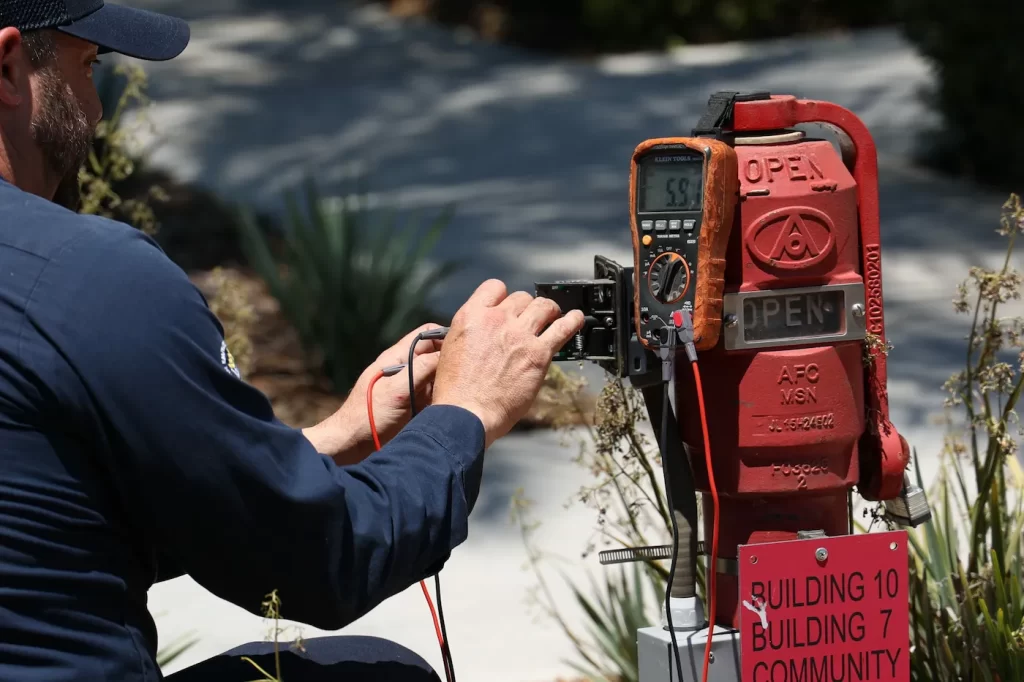 Alarm technician testing a Fire Alarm System